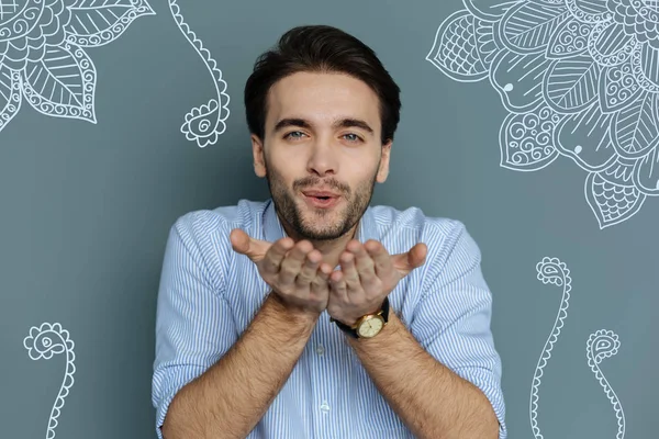 Close up of handsome young man sending air kiss to you — Stock Photo, Image