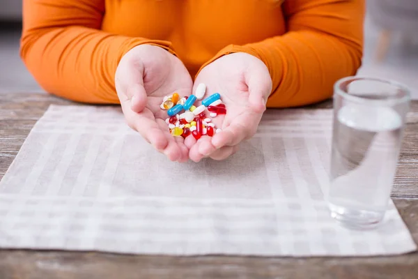 Overweight woman colourful little pills — Stock Photo, Image