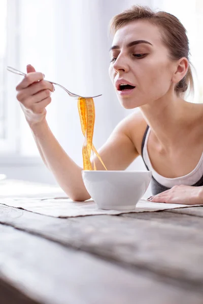 Unhappy young model keeping a diet — Stock Photo, Image