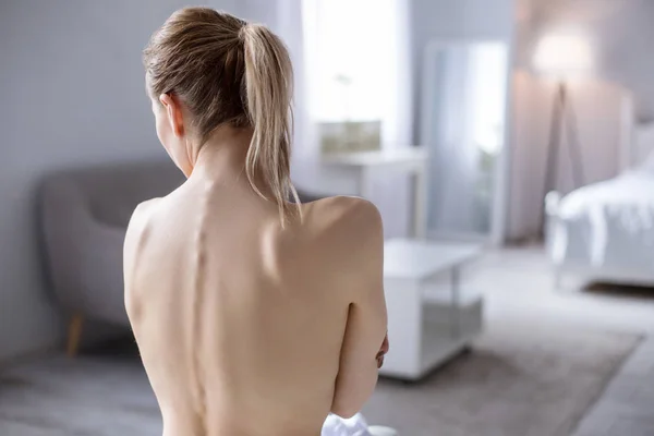 Nice young woman showing her back — Stock Photo, Image