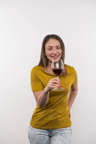 Delighted nice woman holding a glass of wine — Stock Photo, Image