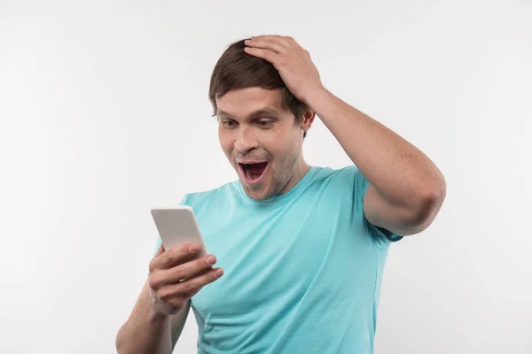 Nice joyful man touching his head — Stock Photo, Image