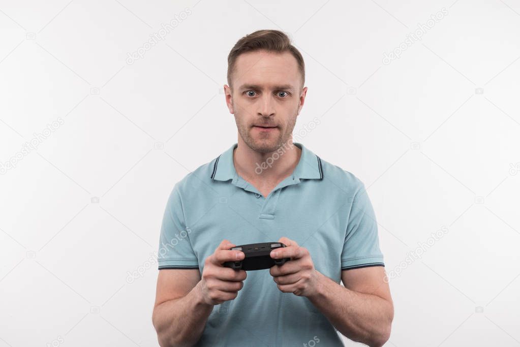 Handsome nice man playing video games