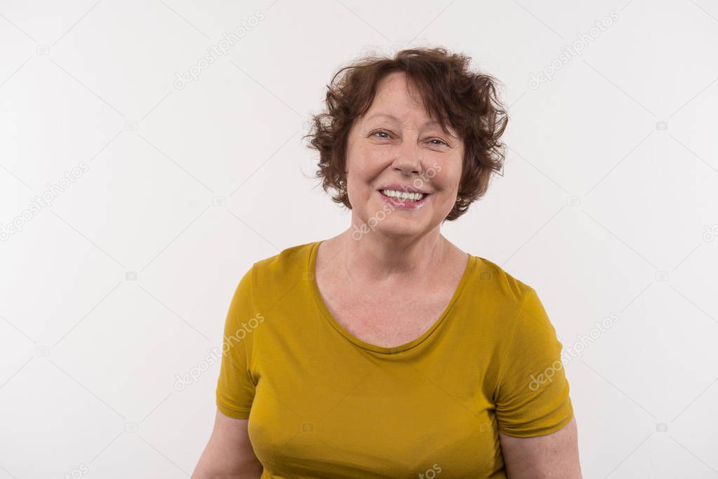Cheerful elderly woman smiling