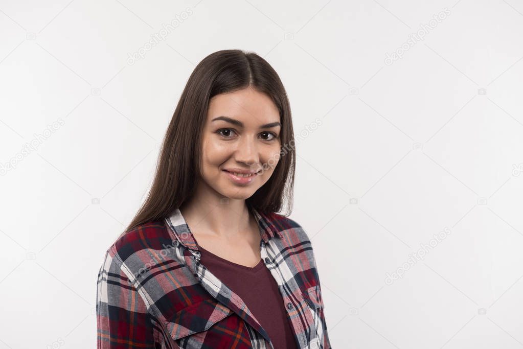 Pleasant delighted woman smiling to you