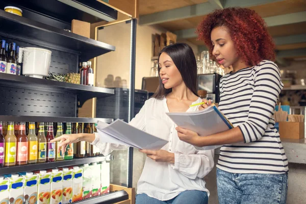 Young business partners owning cafeteria ordering drinks — Stock Photo, Image