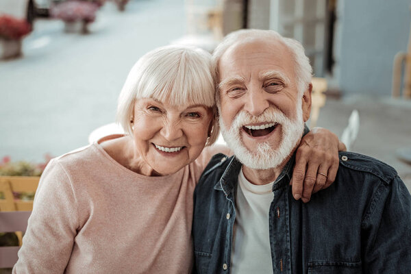 Joyful nice couple being in a great mood