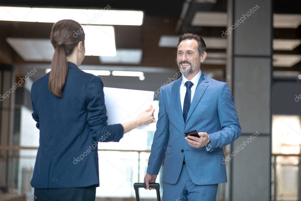 Smiling businessman feeling excited while meeting his business partner