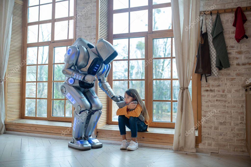 Robot supporting a girl touching her shoulder