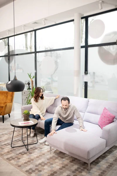 Couple choosing furniture in a modern furniture shop — 스톡 사진