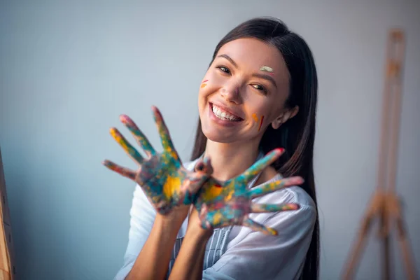 Joyful happy woman showing her hands to you — 스톡 사진