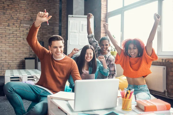 Cheerful students feeling happy while watching webinar together — Stock Photo, Image