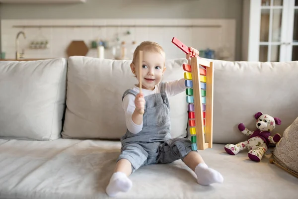 Pretty little baby girl playing with xylophone — Stock Photo, Image