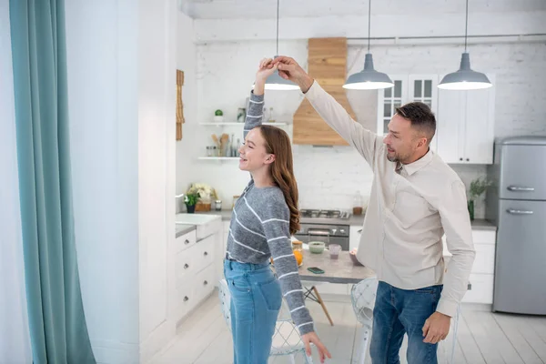 Happy father and daughter dancing at home. — Stock Photo, Image