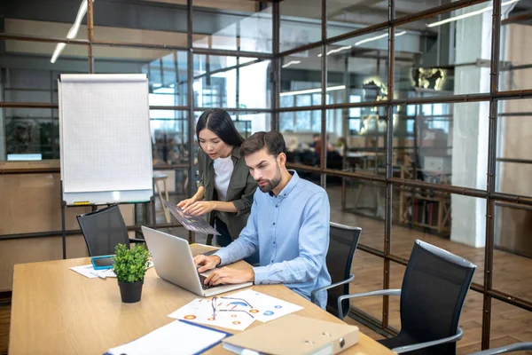 Two colleagues working together and looking busy — 스톡 사진