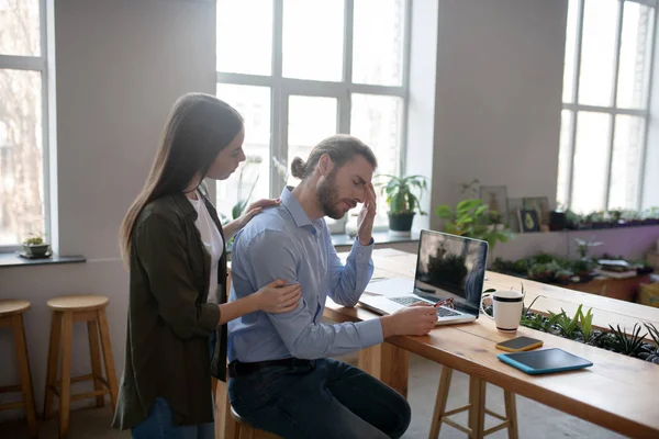 Woman comforting her tired and upset colleague — 스톡 사진