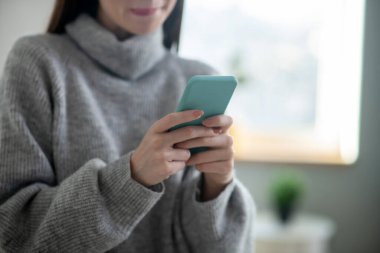 Close up picture of a girl with a tablet in hands