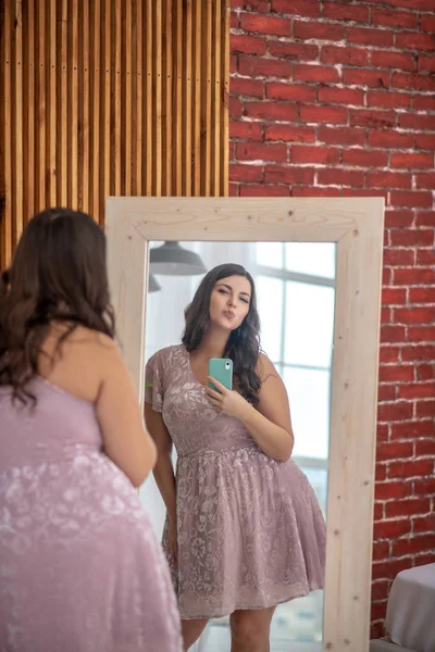 Young plus-size woman making selfie and feeling positive — Stock Photo, Image