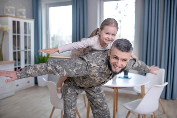 Dad is service man playing with a little daughter. — 스톡 사진