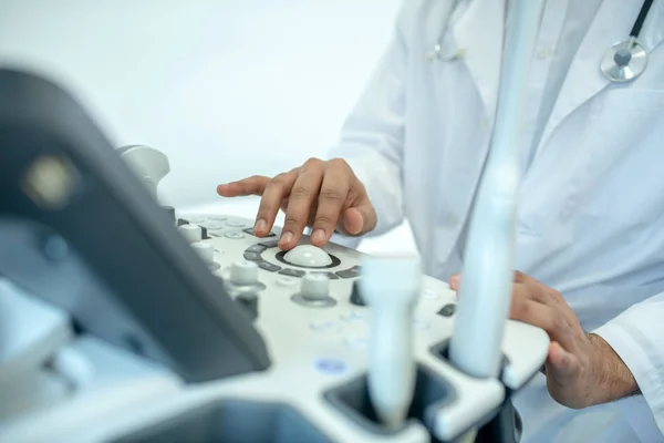 Close up of a doctor sitting at the ultrasound device — Stock Fotó