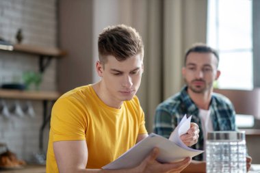 Two young men working together on the project