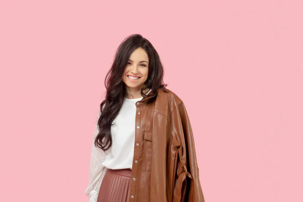 Young pretty dark-haired woman in a pleated skirt looking cute — Stock Photo, Image