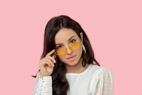 Young woman in a white shirt wearing eyeglasses — Stock Photo, Image