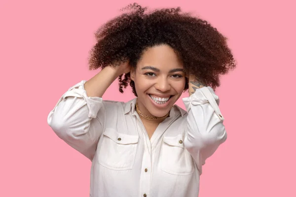 Good looking young woman hands touching hair. — Stock Photo, Image