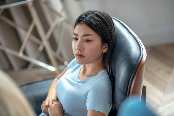 Pretty asian young woman with long hair looking serious — Stock Photo, Image