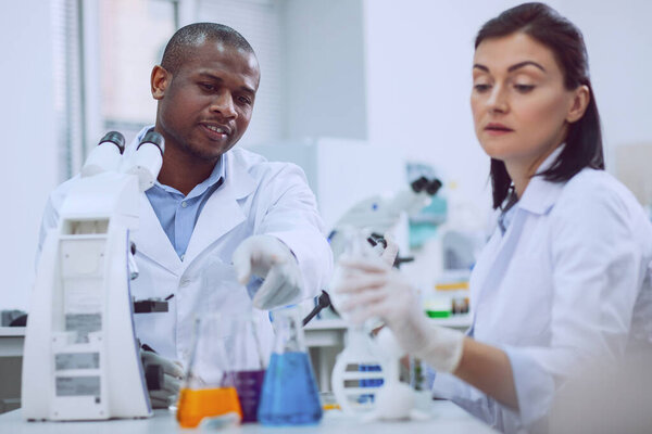 Inspired professional scientists carrying out a test