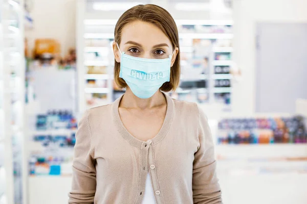 Young adult woman in a protective mask — Stock Photo, Image