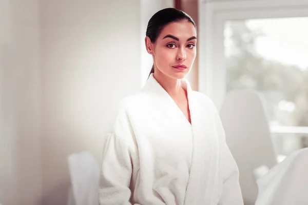 Dark-haired young woman feeling excited before beauty procedures — Stock Photo, Image