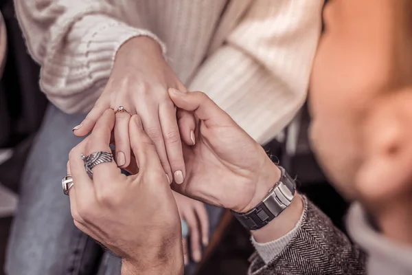 Close up of intertwined hands of future husband and wife — Stock Photo, Image