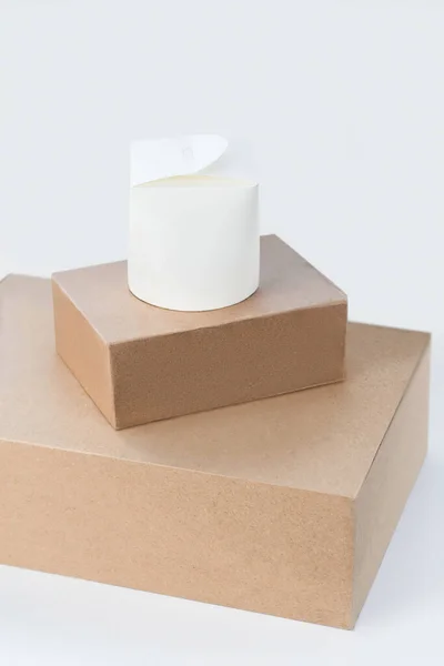 Close up picture of a few brown boxes and a white box — Stock Photo, Image
