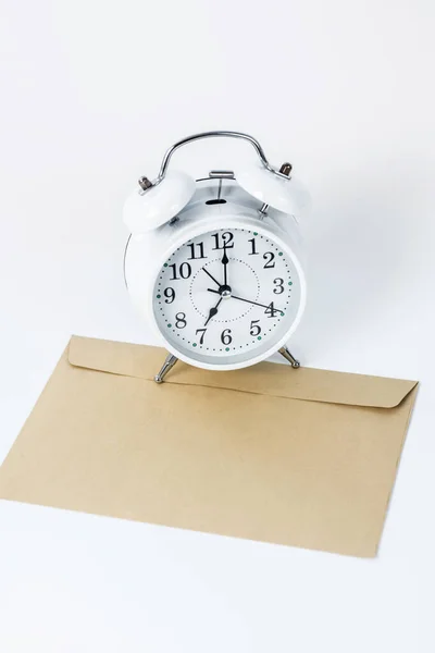 Close up picture of a clock and an envelope under it — Stock Photo, Image
