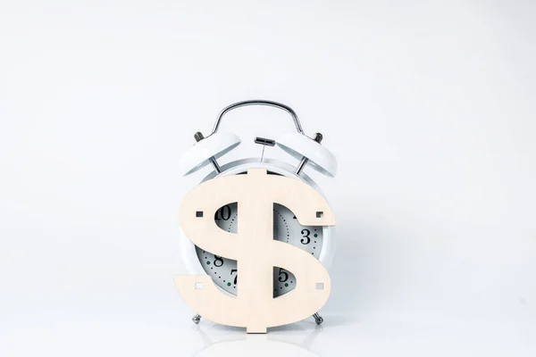 Close up picture of a clock with a sign of dollar on it — Stock Photo, Image