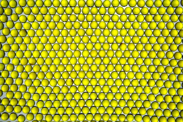 Background Linseed Oil Capsules Bright Yellow Form Geometric Shapes Background — Stock Photo, Image