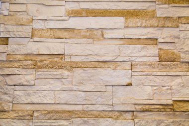 Arka plandaki fayanslar düzensiz dikdörtgen şeklindeki açık bej rengine bakıyor. Arkaplan dokusu inşaatı tasarla.