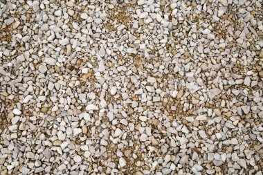 Background of white granite gravel. Backgrounds and textures. Building material. clipart