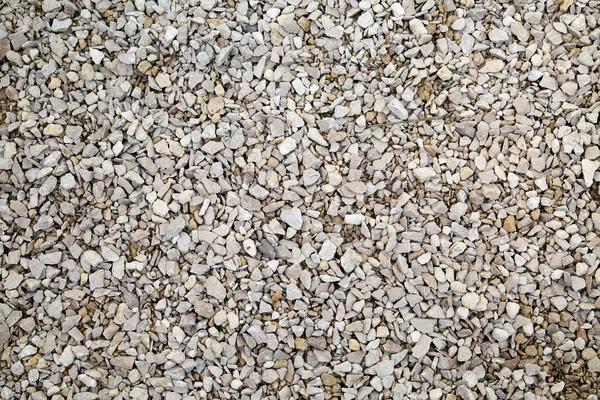 Background of white granite gravel. Backgrounds and textures. Building material.