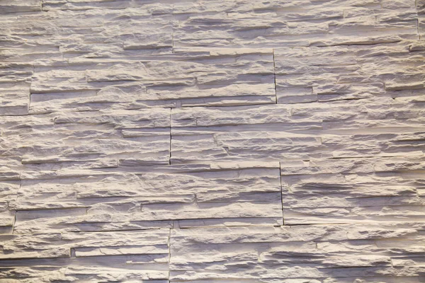 Der Hintergrund Besteht Aus Weißem Kunststein Mit Einer Unregelmäßigen Form — Stockfoto