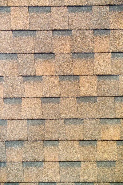 Tile is a multi-layer flexible brown rectangular shape. Construction, background, textures, design.
