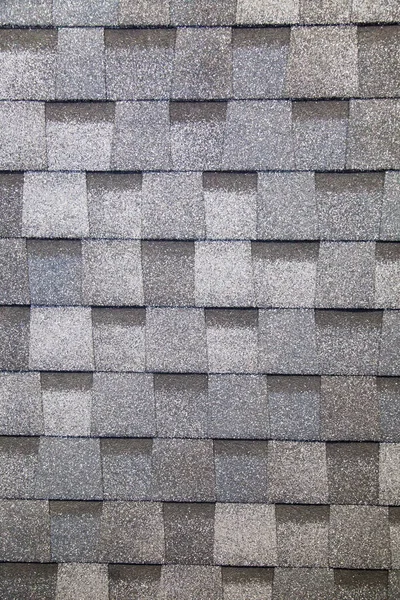 Tile is a multi-layer flexible gray rectangular shape. Construction, background, textures, design.