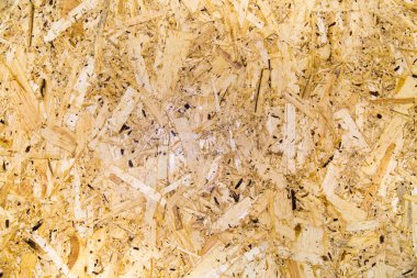 Plakanın arka planı, baskılı çiplerin yapısının güzel bir desenine sahip nemli açık kahverengidir. Tasarım arka plan dokusu inşaatı.