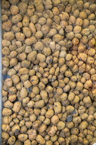 Expanded clay of a large fraction of brown color in the form of round pellets, construction, textures, design. — Stock Image Expanded Clay Large Fraction Brown Color Form Pellets Construction Textures Stock Picture