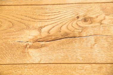Tahta çam ağacının arka planı açık kahverengidir. Ağaç düğümlerinin yapısı da güzeldir. Tasarım arka plan dokusu inşaatı.