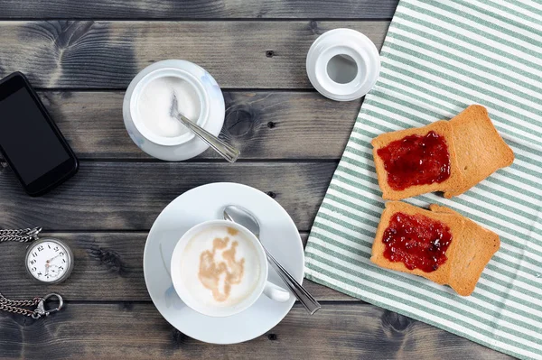 Breakfast with coffee milk and rusks with jam — Stock Photo, Image