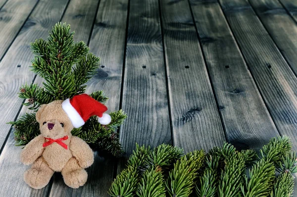 Χριστούγεννα αρκουδάκι σε φόντο ξύλινη — Φωτογραφία Αρχείου
