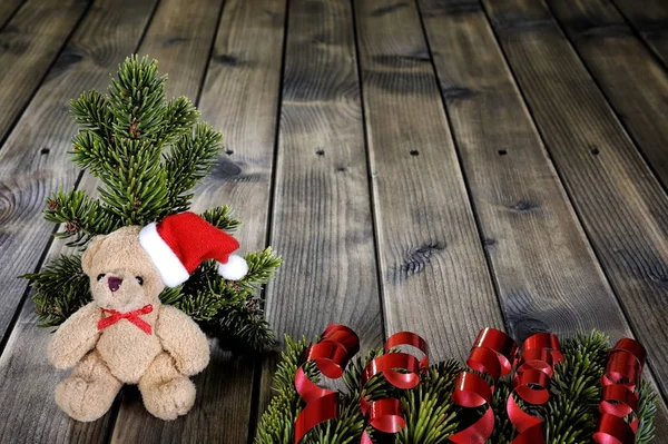 Noel oyuncak ayı ahşap arka plan üzerinde