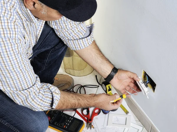 Electrician working in a residential electrical system